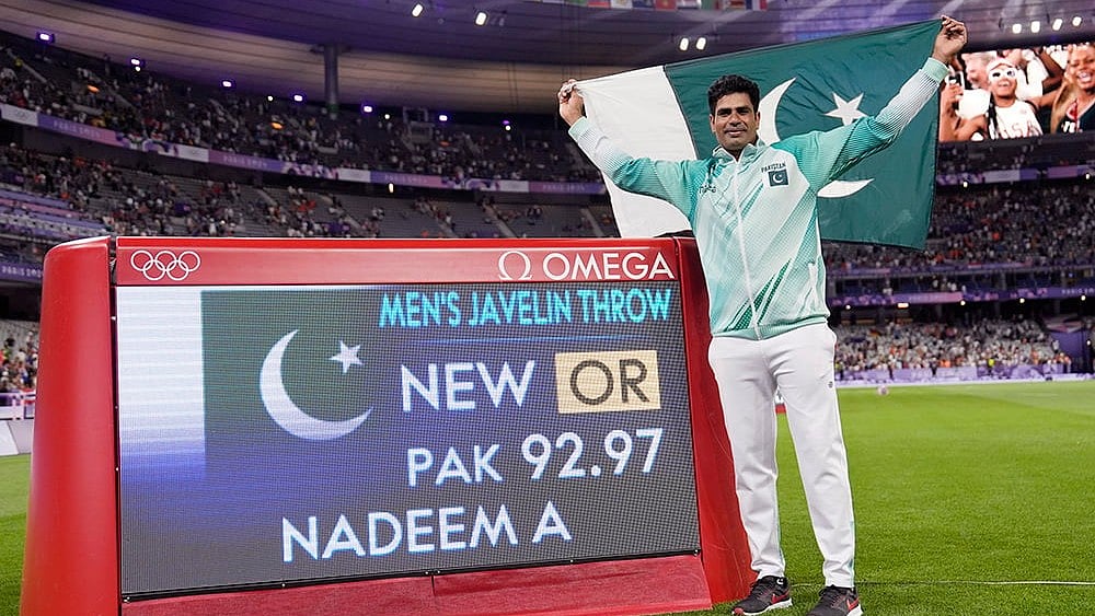 | Photo: AP/Matthias Schrader : Arshad Nadeem, of Pakistan, celebrates after winning gold in men's javelin throw final 